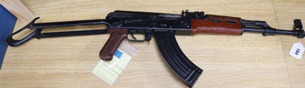 An AK 47 machine gun with deactivation certificate