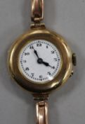 A lady's early 20th century 9ct gold wrist watch on 9ct gold bracelet.