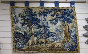 A needlework verdure tapestry, H.80cm, W.114cm