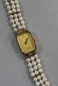 A Marvin Revue 9ct gold lady's quartz wrist watch, with cultured pearl bracelet strap.