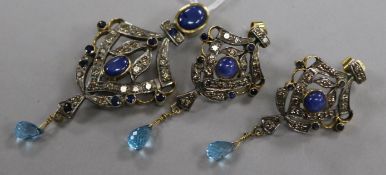 An Indian sapphire and diamond yellow and white metal openwork pendant with topaz drop and a pair of