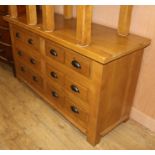 A large oak chest of drawers W.151cm