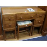 A Brynmawr oak dressing chest, fitted five small drawers and matching dressing stool W.