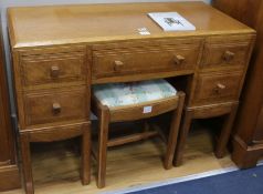 A Brynmawr oak dressing chest, fitted five small drawers and matching dressing stool W.