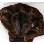 A brown mink evening stole and hat