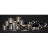 Two pairs of silver napkin rings, four other napkin rings and sundry silver condiments, etc.,