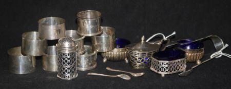 Two pairs of silver napkin rings, four other napkin rings and sundry silver condiments, etc.,