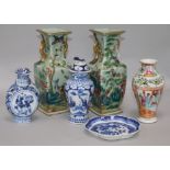 A pair of Chinese famille rose celadon ground vases, two blue and white vases and a spoon tray,
