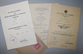 Three WWII German citations with envelope and Hitlers stamp