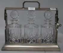 A plated 3 bottle tantalus 28cm