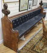 A Victorian carved wood and buttoned leather pew W.240cm