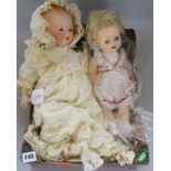 An Armand Marseille Dream Baby doll, No. 341/4K, dressed in Christening gown and bonnet and four