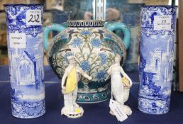 A modern Persian style two handled vase and a pair of blue and white sleeve vases and a pair of