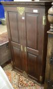 A late 18th century oak hanging corner cupboard W.80cm H.116cm