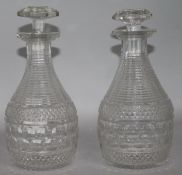 A pair of Regency cut glass decanters 21.5cm.