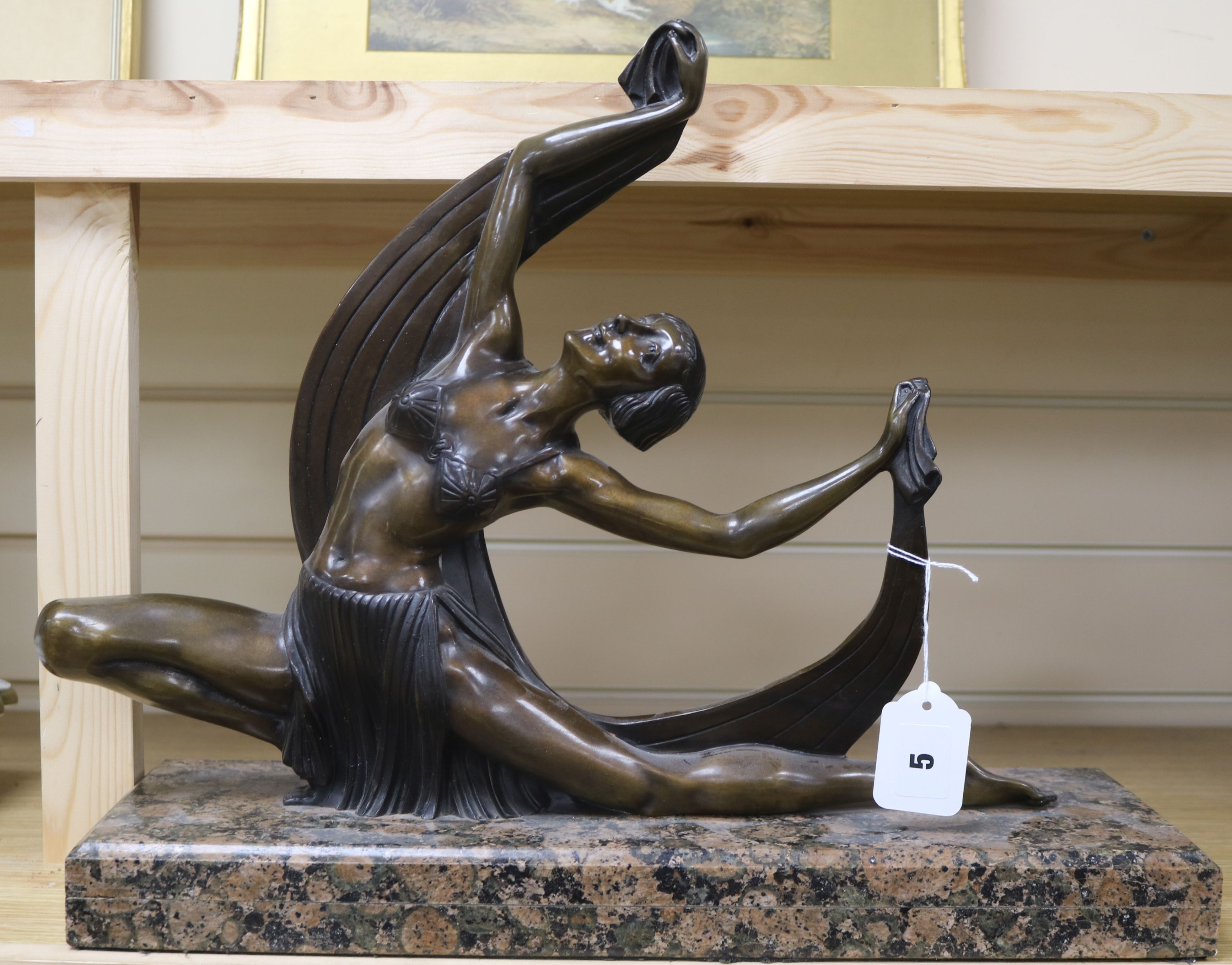 An Art Deco style bronze figure of a dancer H.39cm. W.47cm.