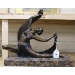 An Art Deco style bronze figure of a dancer H.39cm. W.47cm.