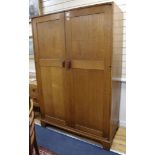 A Gordon Russell oak two door wardrobe W.122cm H.183cm