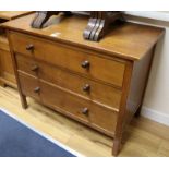 A pair of Gordon Russell oak chests, fitted with three long drawers W.99cm