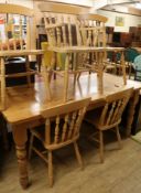 A pine table and chairs W.168cm