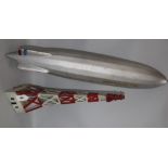 A pre-war papier mache model of a Goodyear zeppelin with a tin plate stand 74cm.