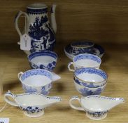 A near pair of 18th century blue and white cream boats, a similar Fisherman and Cormorant pattern