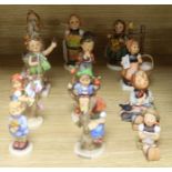Twelve Goebel Hummel figures of children, to include 'Serenade', 'Happy Pastime', 'Apple Tree