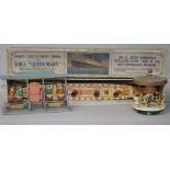 A boxed Queen Mary model and two miniature wooden fairground toys