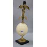 An ormolu egg candlestick H.34cm