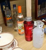 Six bottles of assorted spirits including Grey Goose and Absolut flavoured vodka and Old Krupnik