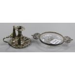 A George V silver mounted 2 handled glass dish and a plated chamberstick.