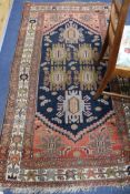 An Eastern rug 200 x 115cm