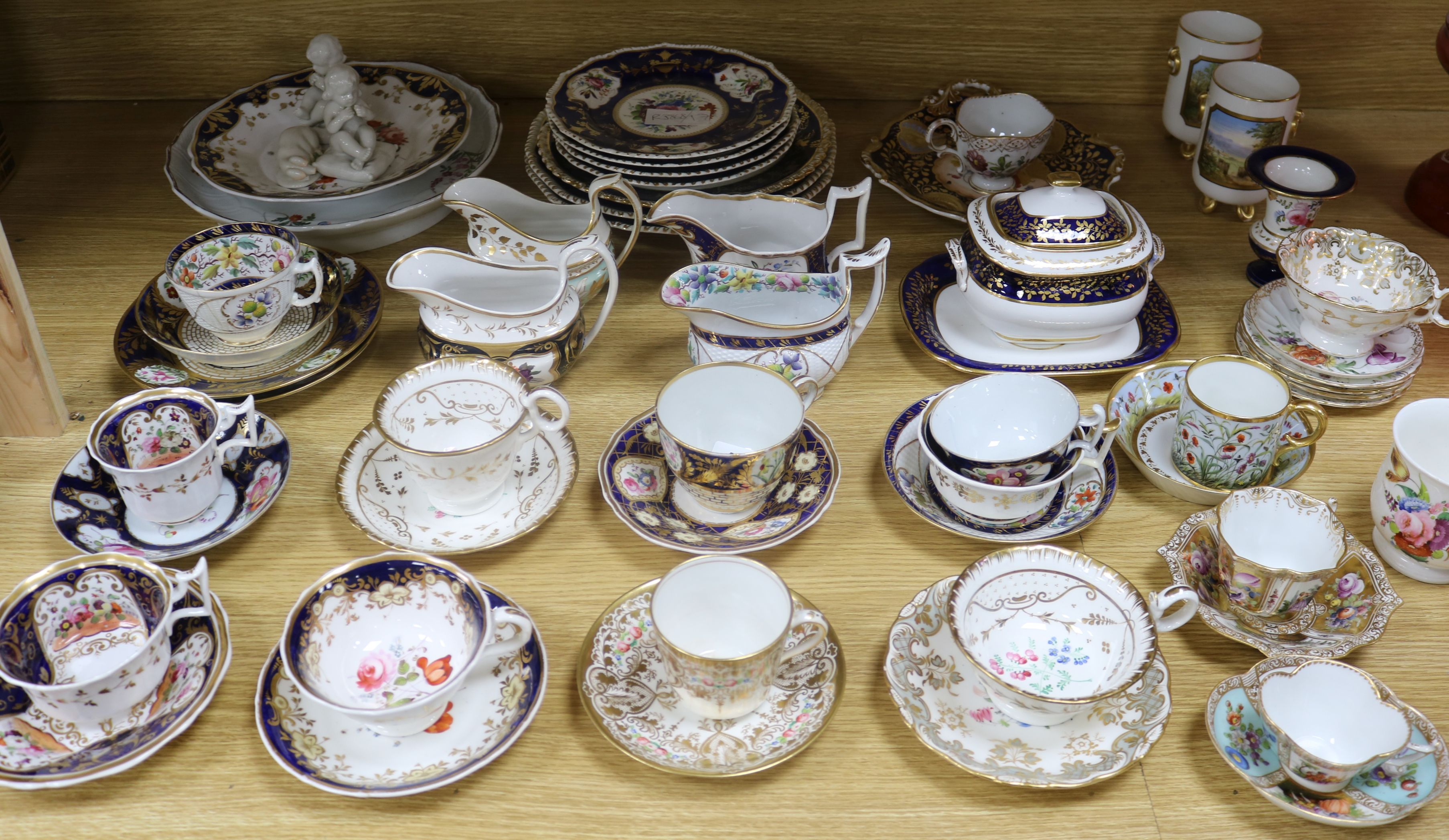 A collection of 19th century porcelain tea wares including a tea cup and saucer