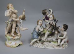 A Thuringian porcelain group of four bacchanal with goat and a Volkstedt group of two putti, each on