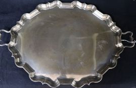 A George V silver two handled shaped oval silver tea tray, Thomas Bradbury & Sons, London, 1924,
