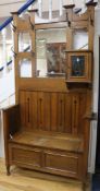 An early 20th century 'Arts & Crafts' oak hall stand H.110cm
