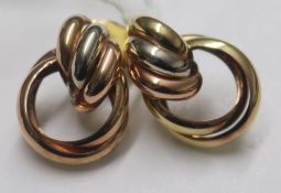 A pair of three colour 9ct gold triple loop earrings, gross weight 5.1 grams.