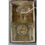 A Guerlain Mitsouko perfume bottle and box