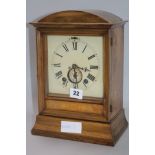 A walnut mantel clock H.30cm.
