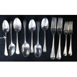 Seven assorted Georgian and later silver dessert spoons, a Georgian silver table fork and three