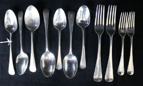 Seven assorted Georgian and later silver dessert spoons, a Georgian silver table fork and three