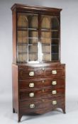 A Regency mahogany secretaire bookcase, with gothic arched astragal glazing and four drawers, W.