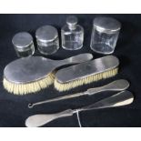 An eight-piece silver-mounted part dressing table set.