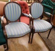 A Victorian mahogany prie dieu chair and a pair of elbow chairs