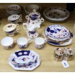 A collection of Gaudy Welsh tableware, including a two-handled pot and cover, a jug, cups,