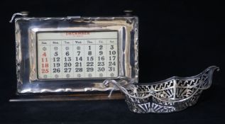 A 1920's silver mounted desk calendar and a late Victorian pierced silver dish.
