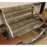 A rustic style cast iron garden bench