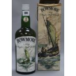 A Boxed bottle of Bowmore single malt whisky