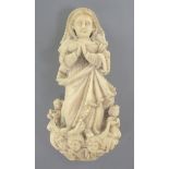 A Goanese ivory figure of the Virgin Mary, 17th / 18th century, standing on a scrolled plinth with