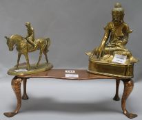 A brass horse and rider, Buddha and kettle stand